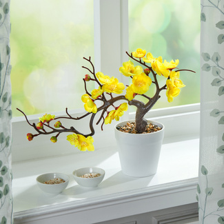 Kunstblume gelb im Topf Kunstblume gelb im Topf