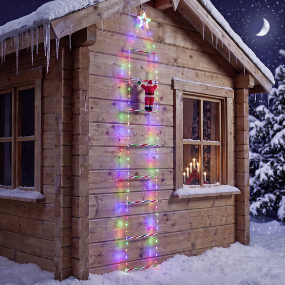 Weihnachtsmann auf beleuchteter Leiter