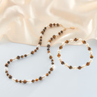 Muschelarmband mit Tigerauge